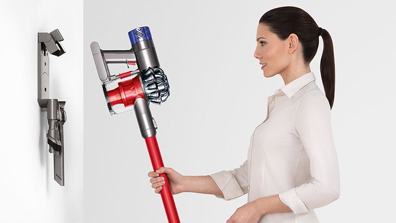 Model with Dyson wall-mounted dock